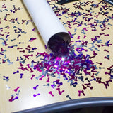 Other Image: Confetti shaped like penises spilling from a tube.